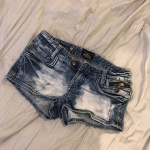 Distressed denim shorts